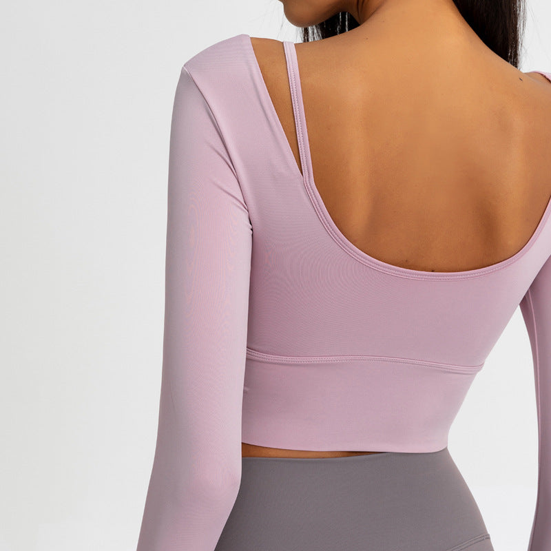 Light pink long-sleeve yoga top, scoop back, cropped fit