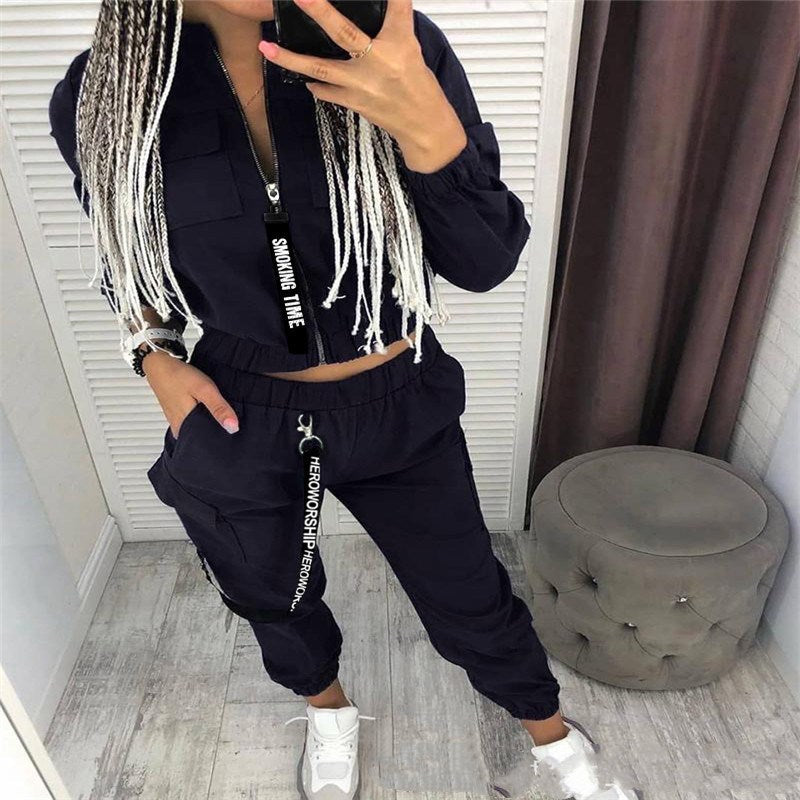 Black zip-front jumpsuit set with cargo pockets and drawstring waist, long sleeves