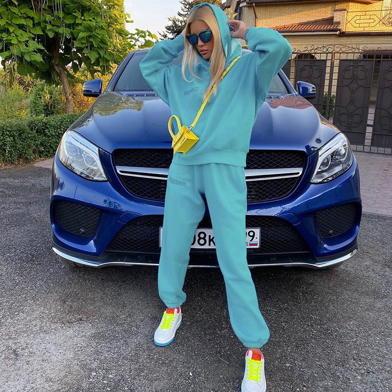Teal loose jogger pants with tapered legs and elastic ankle cuffs