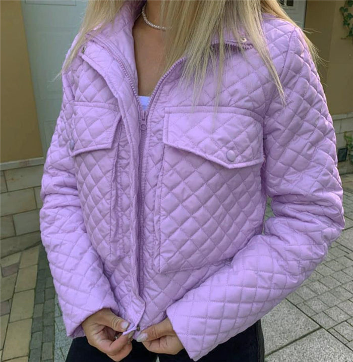 Purple quilted winter jacket with full-zip front and two flap chest pockets.
